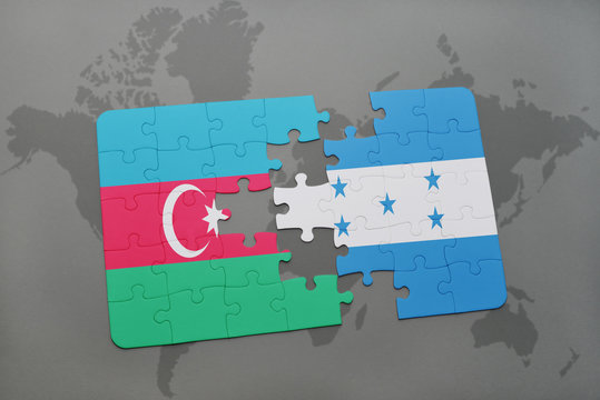 puzzle with the national flag of azerbaijan and honduras on a world map