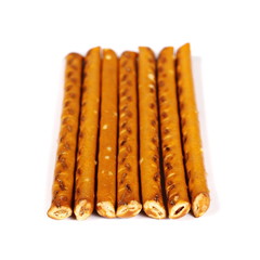 salty cracker pretzel sticks isolated on white background