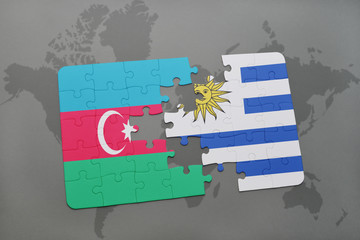 puzzle with the national flag of azerbaijan and uruguay on a world map