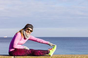 Woman fitness sport girl training outdoor in cold weather