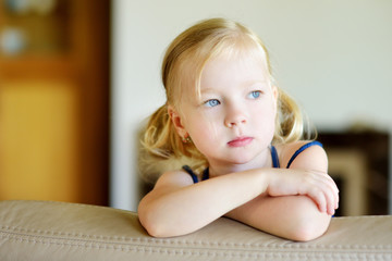 Fototapeta premium Portrait of a cute and funny little girl