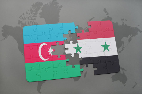 puzzle with the national flag of azerbaijan and syria on a world map