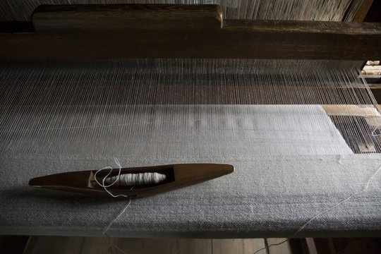 High angle view of spool and loom in textile industry