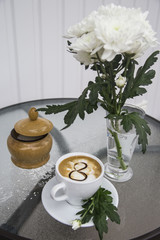 coffee and chrysanthemum in a vase on March 8