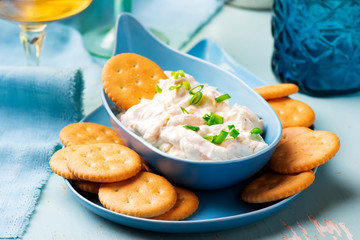 French onion dip with crackers.