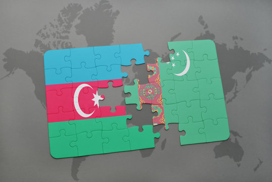 puzzle with the national flag of azerbaijan and turkmenistan on a world map