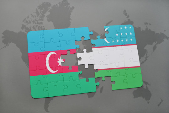 puzzle with the national flag of azerbaijan and uzbekistan on a world map