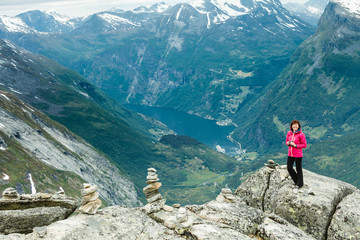 Fototapeta premium Tourist woman on Dalsnibba viewpoint Norway