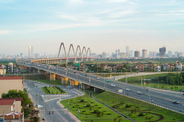 Hanoi skyline at twilight at Vo Chi Cong street, leading to Nhat Tan cable-stayed bridge, Dong Anh district