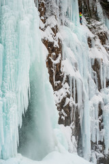 Frozen waterfall with Ice Climber in Background