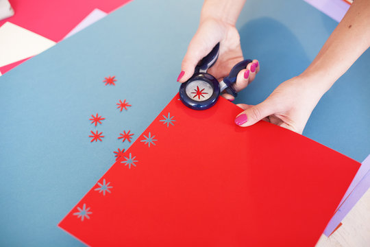 Young woman make scrapbook of the papers on the table using anti