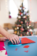 Young woman make scrapbook of the papers on the table using anti