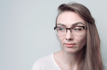 Fototapeta premium Young woman in glasses. Portrait