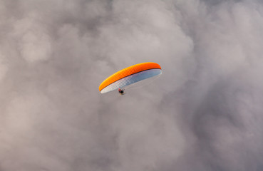 aerial view of paramotor flying over the clouds
