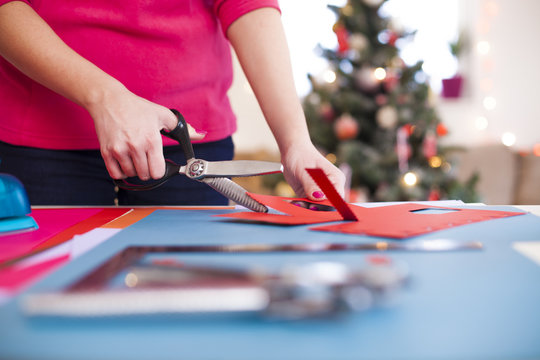 Young woman make scrapbook of the papers on the table using anti