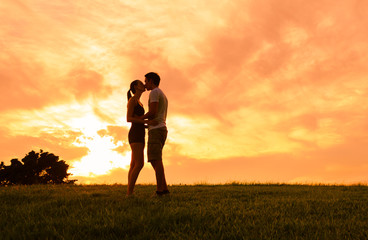 Young couple kissing in a beautiful setting. 