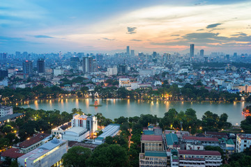 Fototapeta na wymiar Aerial skyline view of Hoan Kiem lake (Ho Guom, Sword lake) area at twilight. Hoan Kiem is center of Hanoi city. Hanoi cityscape.