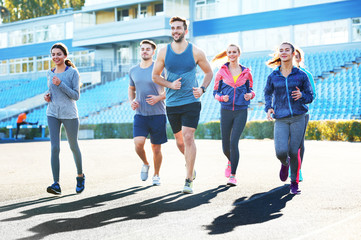 Sportsmen running at stadium