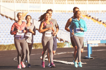 Sportsmen running at stadium