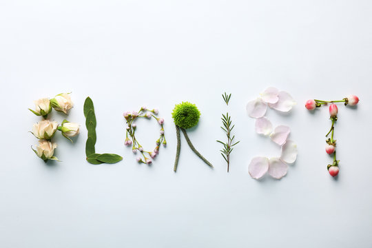Word Florist made of plants on white background