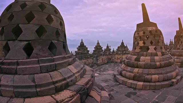 View of Buddhist Stupas and statues of Borobudur ancient temple Java Indonesia