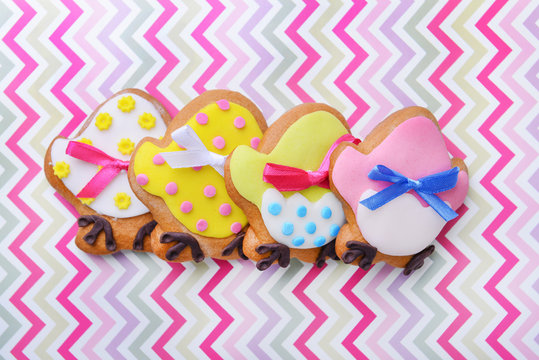 Creative Easter cookies on colour background