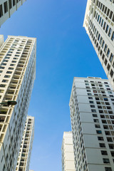 Fototapeta na wymiar Resident apartment buildings against blue sky