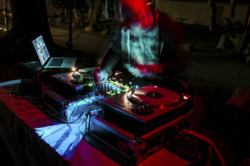 Blurred motion of man playing music in night club