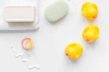 baby accessories for bath with duck on white background