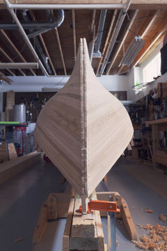 Wooden boat in workshop