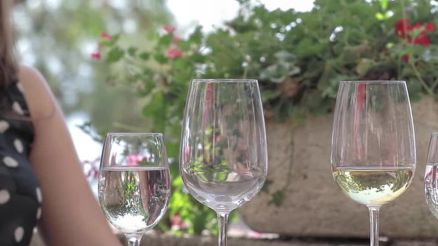 Waiter pouring wine