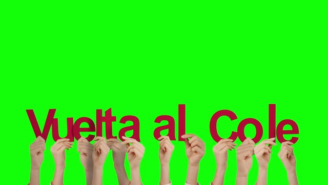 Hands holding up vuelta al cole