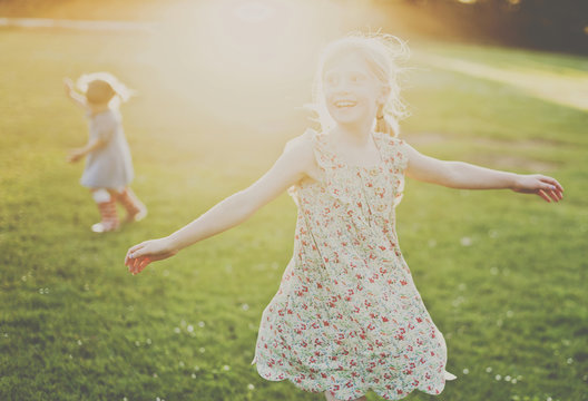 Cheerful girls playing on field