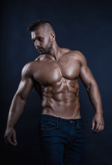 Fototapeta na wymiar Handsome, young, masculine, sexy and muscular fitness model