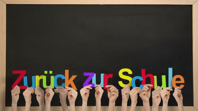 Hands holding up zuruck zur schule