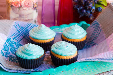 Homemade cupcakes with mint cream towel