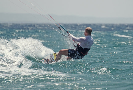 young white male kitesurfing in bodrum 