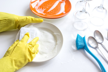 concept of woman washing dishes on white background