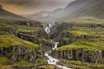 Mjoifjordur, Iceland - Waterfall cascading down natural steps fr