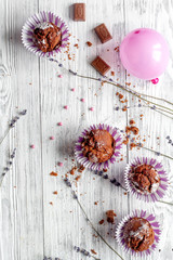 concept of Valentine's Day cupcakes wooden background top view