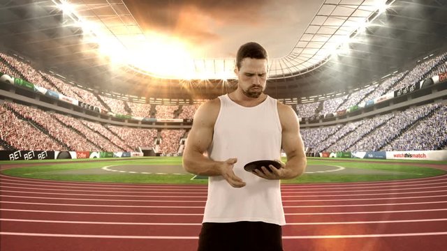 Male athlete practicing discus throw