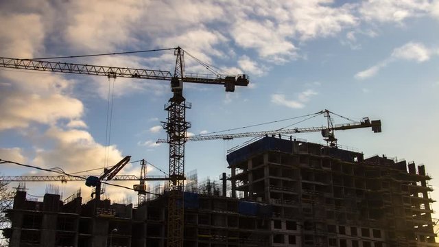 Cranes working on construction of the housing estate in former industrial zone time lapse
