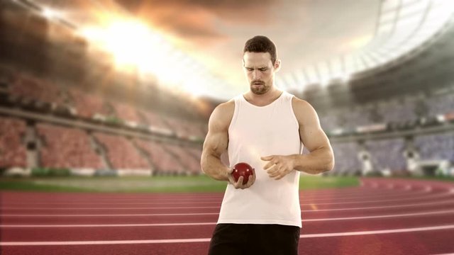 Male athlete preparing to throw shot put ball