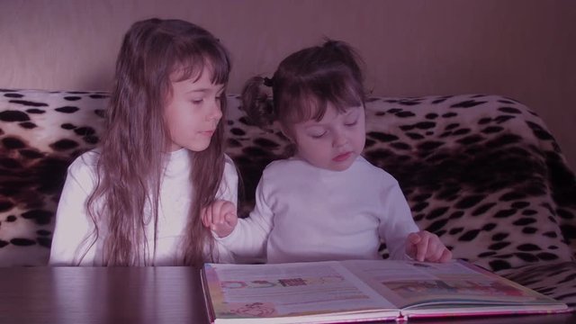 Children reading the book. Full HD