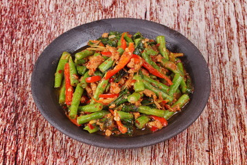 Spicy fried cowpea with minced pork call Pad Ped Tua.