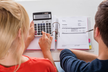 Couple Calculating Invoice