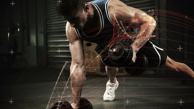 Athlete performing push ups with dumbbell against the animated background