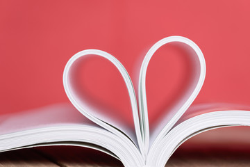 Love concept of heart shape from book pages.