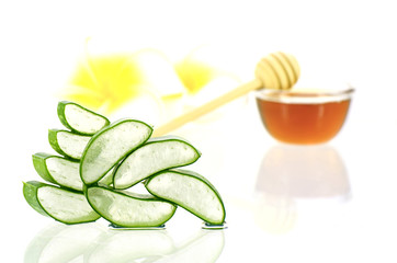 Aloe vera and honey for hair and facial treatment.