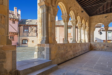 Segovia - The portico of Romanesque church Iglesia de San Lorenzo and the square with the same name.